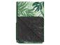 Picknickdeken met tropisch groen en zwart bladmotief.