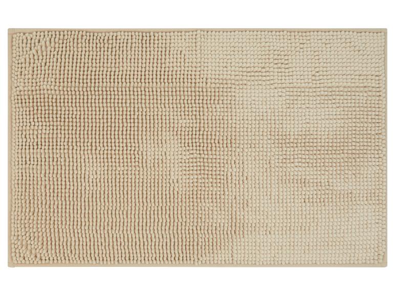 Zachte, beige badmat.