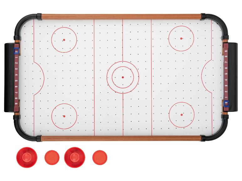 Airhockeytafel met rode pucks en scoretellers.