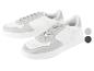 Witte U.S. Grand Polo sneakers met grijze details.