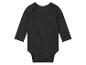 Een zwarte baby romper met lange mouwen.
