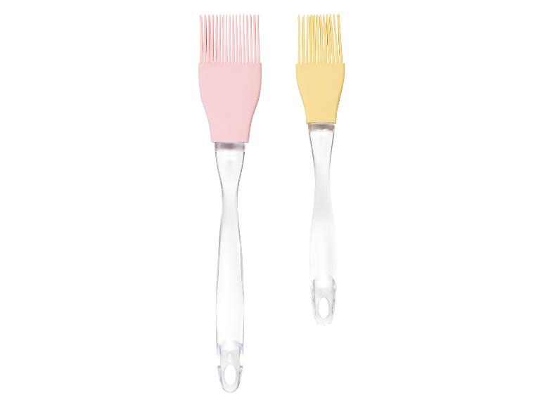 Twee siliconen bakkwasten met een transparante handgreep.