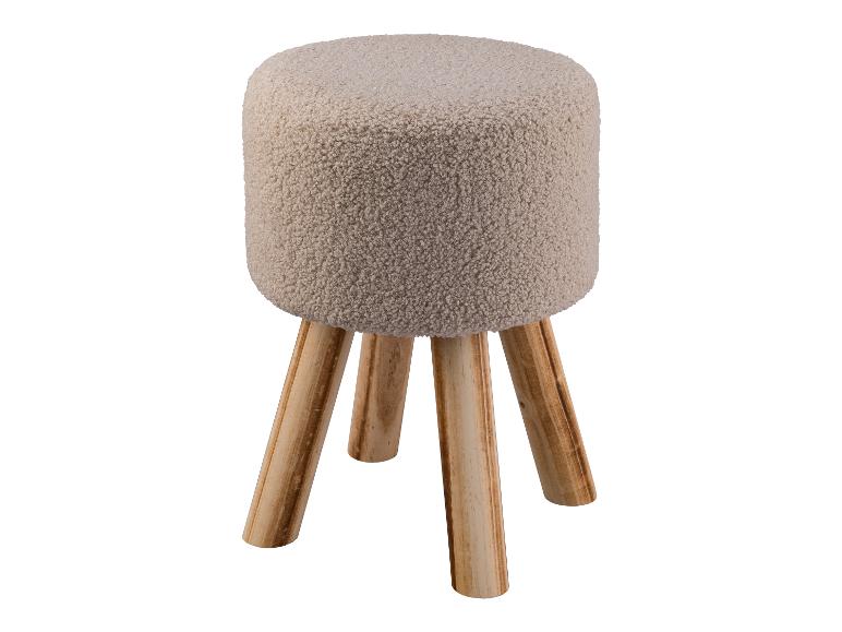 Een ronde poef met een zachte, pluche bekleding en houten poten.