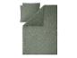 Groen mousseline beddengoed met madeliefjespatroon.