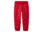 Rode kinderjoggingbroek met sneeuwvlokkenprint en trekkoord in de taille.