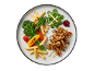 Gebakken kipreepjes met frietjes, bimi en frisse salade op een bord.