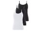 Drie basic tanktops, twee zwart en één wit.