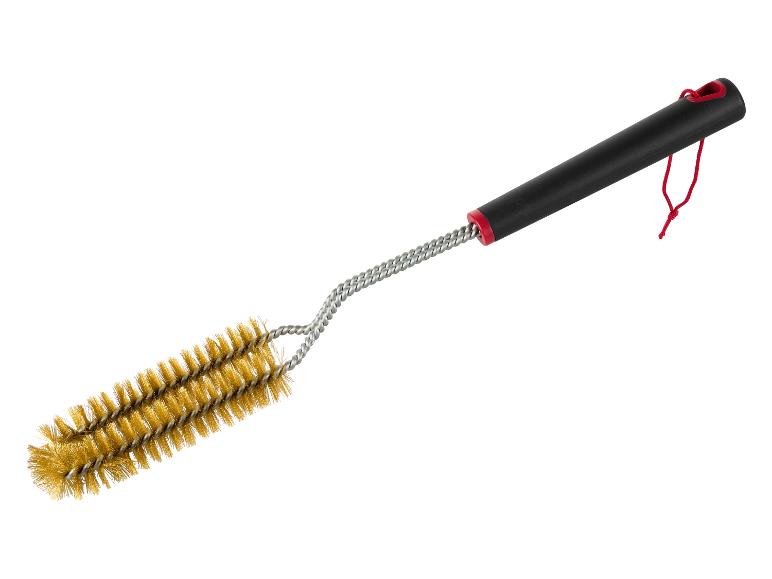 Een grillborstel met een zwarte handgreep en draadborstels.