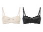 Twee beha's, één in zwart en één in beige, met bloemenkant.