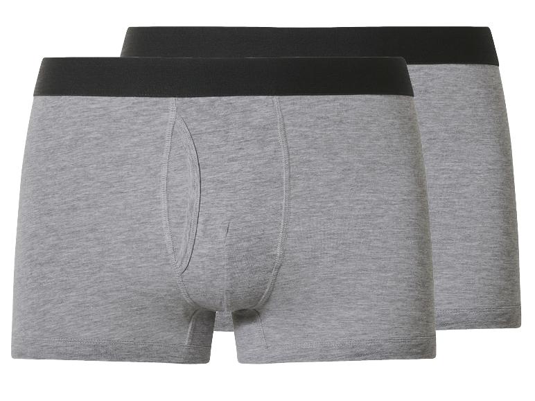 Twee grijze herenboxershorts met een zwarte tailleband.