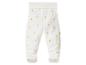 Witte babybroek met voetjes en gele eendenprint