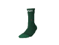 Groene sok met een feestelijk gereedschapsmotief in de vorm van een kerstboom.