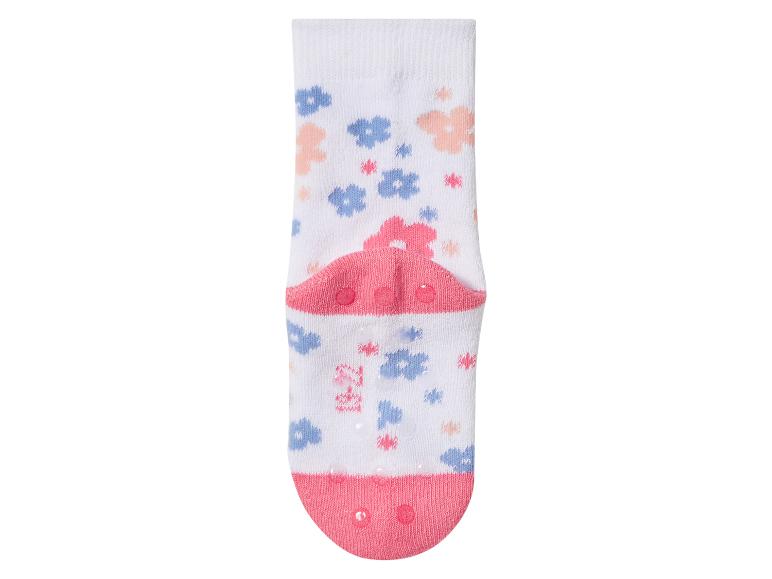 Witte babysokken met bloemenpatroon en antislipzool