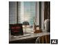 Laptop met 'Light. Inspired by life.' tekst, tafellamp en decor bij een raam.