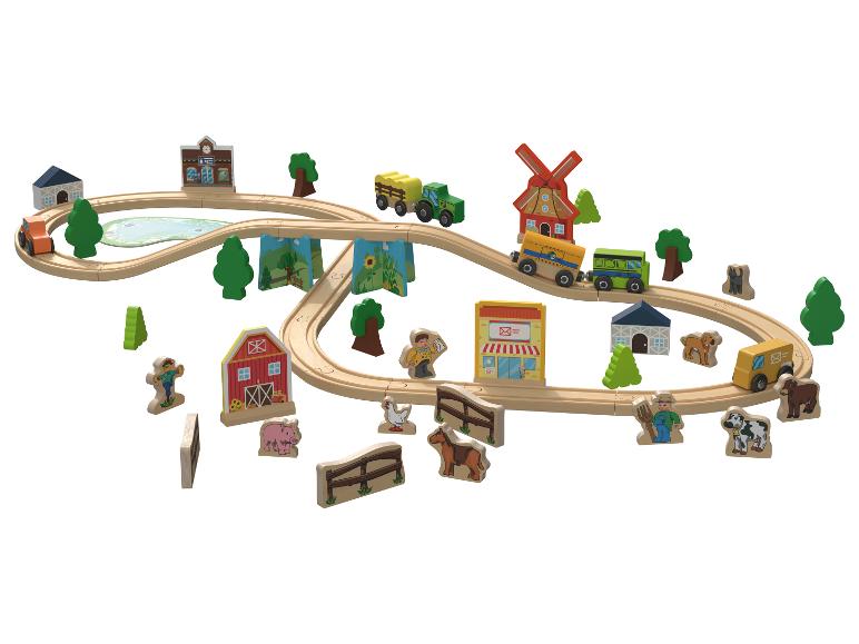 Houten boerderij-thema treinset met rails, voertuigen en figuren.