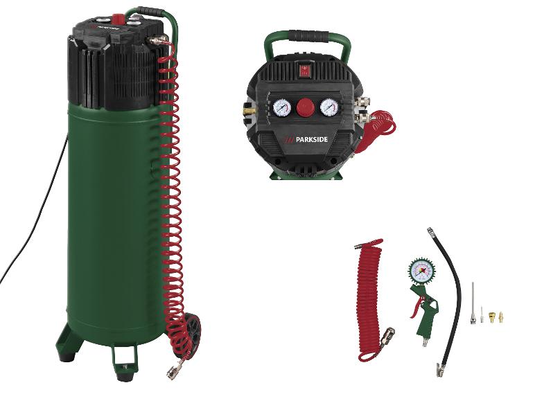 Luchtcompressor met een rode spiraalslang, manometers en diverse mondstukken.