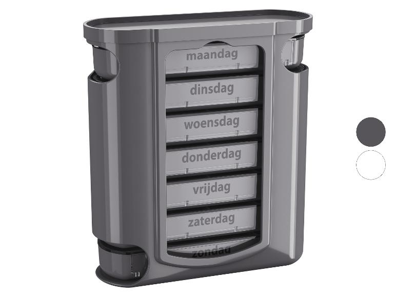 Grijze wekelijkse pillendoos met vakjes gelabeld voor elke dag.