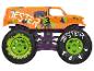 Oranje monster truck met narrenthema, met groene en zwarte wielen.