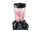 Zwarte blender met roze smoothie erin, met een doorsnede van de motor.