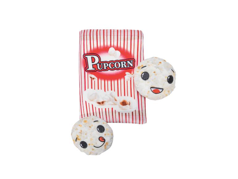 Hondenspeeltje met 'Pupcorn' popcornzak en twee popcorns met lachende gezichtjes.