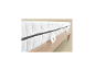 LIVARNO home matras met ritssluiting en handgrepen op een houten bedframe.