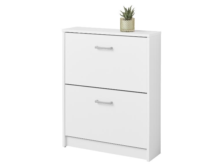 Witte schoenenkast met twee lades en een kleine plant erbovenop.