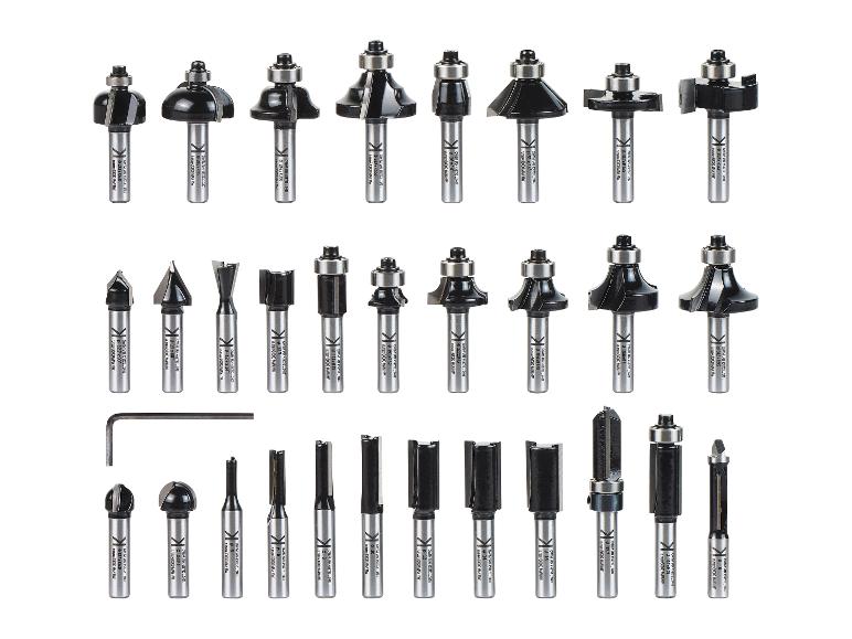 Een set van diverse bovenfreesbits en een inbussleutel.