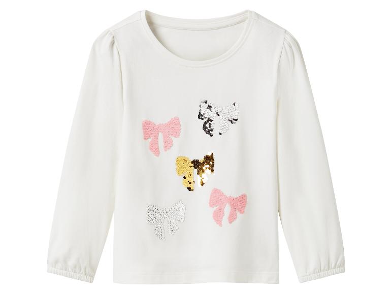 Wit longsleeve shirt voor meisjes, versierd met pailletten strikjes.