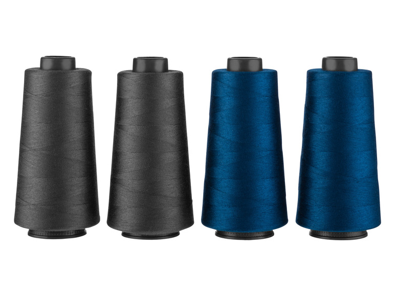Twee spoelen zwarte en twee spoelen blauwe garen.