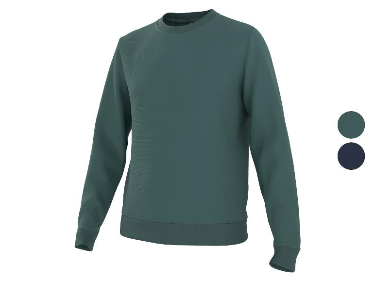 Een donkergroen sweatshirt met lange mouwen.