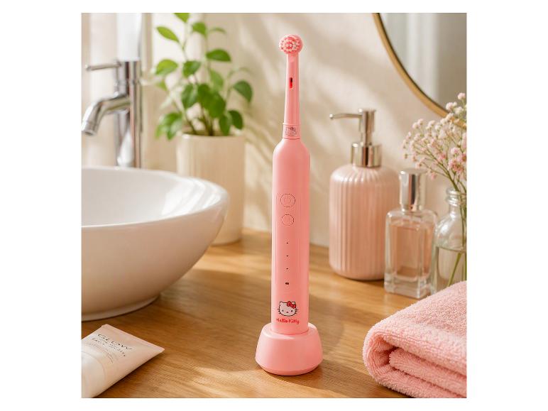 Roze Hello Kitty elektrische tandenborstel in een badkamer.