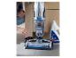 Vloerreiniger met reinigingsoplossing en accessoires.