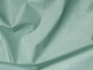 Gladde, lichtgroene stof met vouwen.