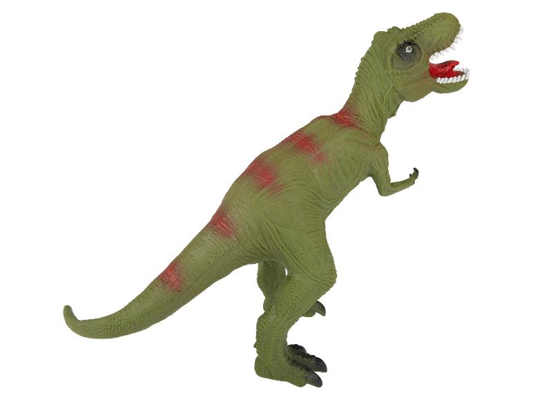 Een groene plastic T-Rex dinosaurus speelgoed.