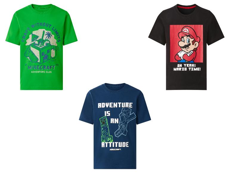 Drie kinder-T-shirts: groen met 'Craft Without Limits', zwart met 'Mario Time!' en blauw met 'Adventure is an Attitude'.