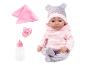 Babypop in roze hoodie en pyjama met patroon, met speen, fles en deken.
