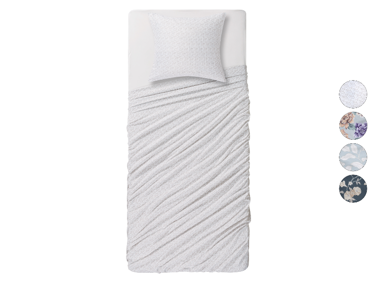 Enkel beddengoed met verschillende bloemenprints.