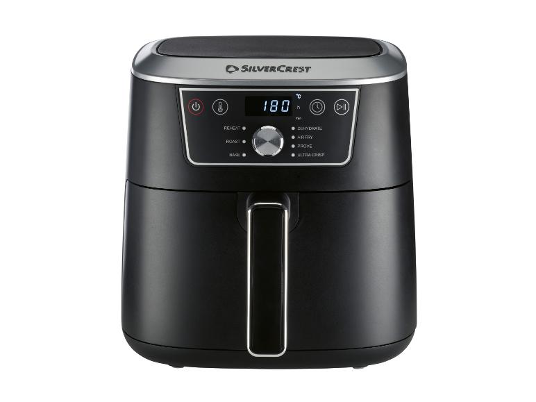 Zwarte heteluchtfriteuse met digitaal display dat 180°C toont en bedieningsopties.