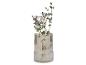 Geribbelde glazen vaas met paarse bloemen en eucalyptus takken