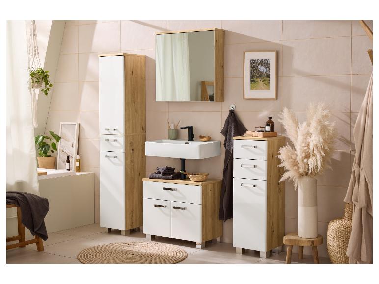 Moderne badkamer met wit en houtkleurig meubilair, wastafel, spiegel en decoratieve planten.