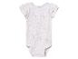 Baby body met korte mouwen, licht beige bloemenprint.