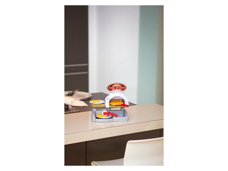 Speelgoed pizzastation op een aanrecht.
