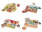 Vier houten puzzels met verschillende thema's: bos, transport, boerderij en jungle.