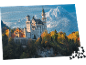 Legpuzzel met een afbeelding van slot Neuschwanstein in de herfst met bergen op de achtergrond.