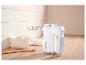 Witte SilverCrest handmixer met gardes, kom met deeg, eieren en houten lepel op aanrecht.