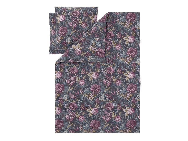 Bloemig dekbedovertrekset met kussens in donkergrijze, roze en blauwe tinten.
