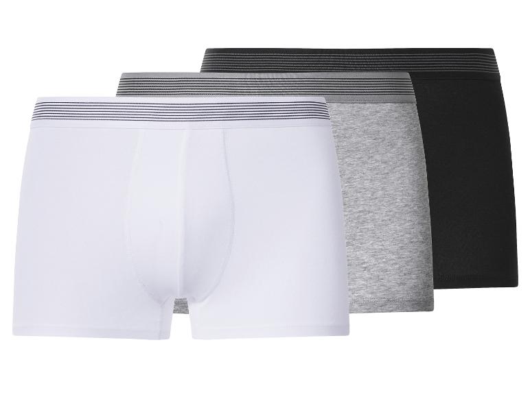 Drie herenboxershorts in wit, grijs en zwart met gestreepte taillebanden.