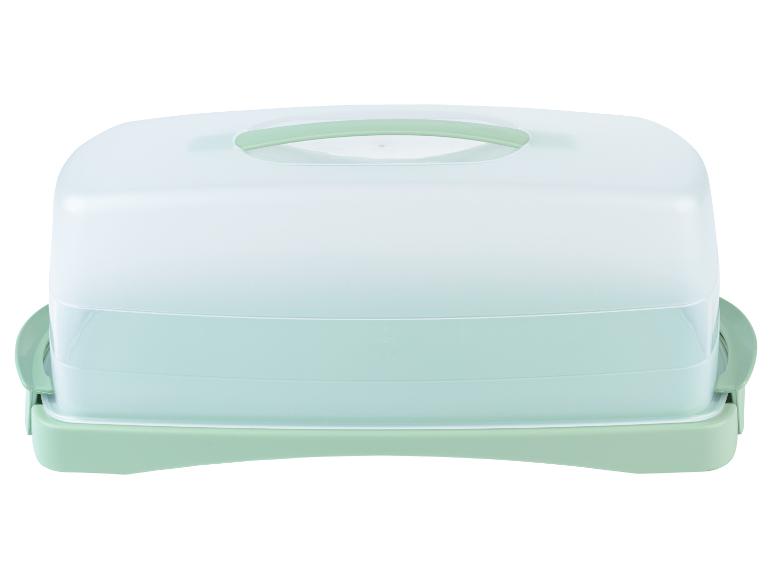 Een groene plastic cake-doos met deksel.