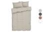 Lichtbeige beddengoedset met kussens.