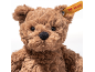 Pluizige bruine teddybeer met een geel label in zijn oor.